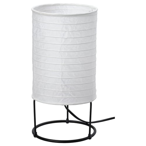 A white STRANDAD table lamp with a cylindrical rice paper shade and a black metal base.