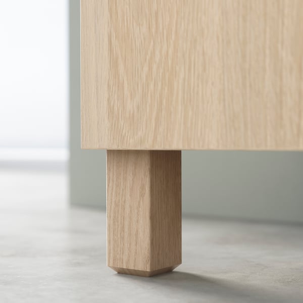 An oak STUBBARP leg, part of IKEAs bestå series, designed to elevate and stabilise storage solutions.