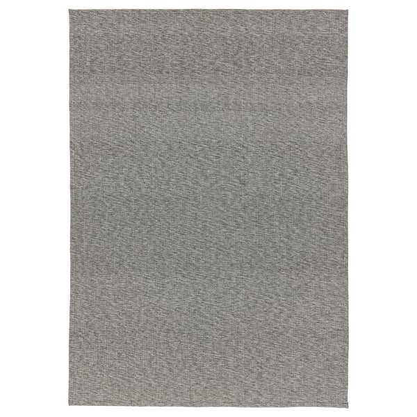 A TIPHEDE rug, rectangular, black and white, woven cotton.