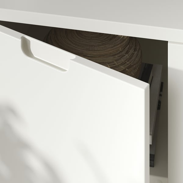 White TONSTAD cabinets corner with soft-close hinge.