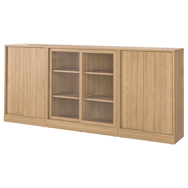 TONSTAD oak bookcase with glass & sliding doors, light wood grain, rectangular shape, modern design.