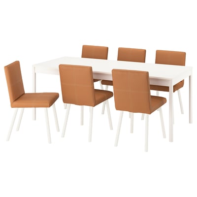 A modern white dining set from TONSTAD with six brown leather chairs around a rectangular table.