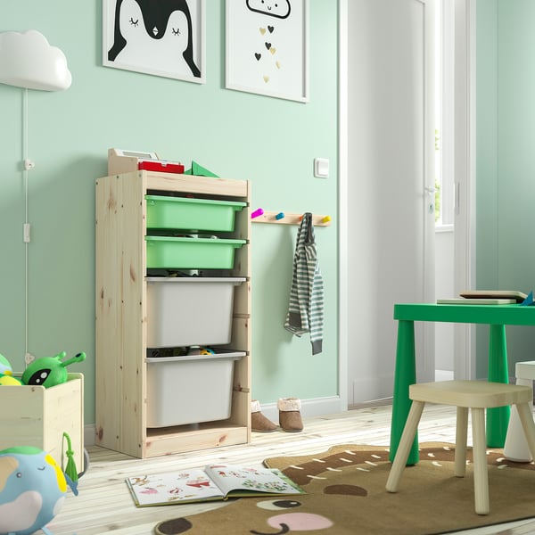 TROFAST storage: light wood, green & white bins, kids room, with coat hooks.