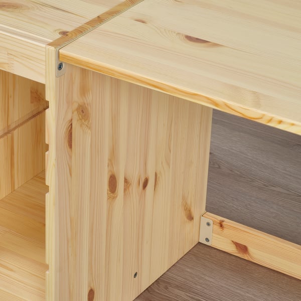 Light wooden desk corner, smooth surface, visible grain. Attached securely, modern design.