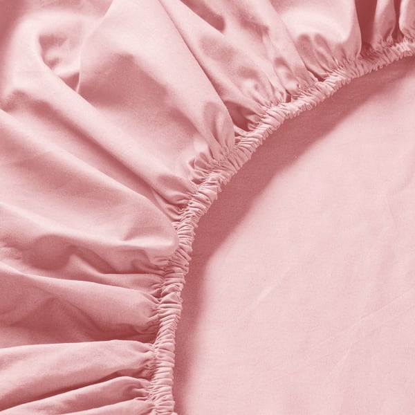 Close-up of light pink, soft, crisp sheet with elastic edges, showcasing smooth, high-quality fabric and precise stitching.