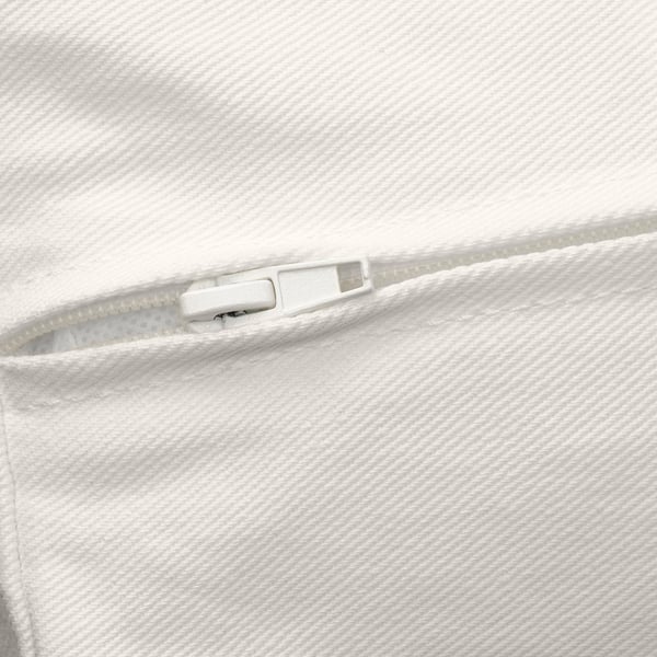 A close-up a white zip on a soft, textured fabric. The zip pull is smooth and slides easily, indicating high-quality construction.