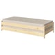 A UTÅKER pine wood single bed with a beige mattress. Its simple, stackable, and ideal for space-saving.