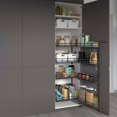 Pull-out kitchen cabinet with organised storage: jars, boxes, and containers on multiple shelves for easy access.