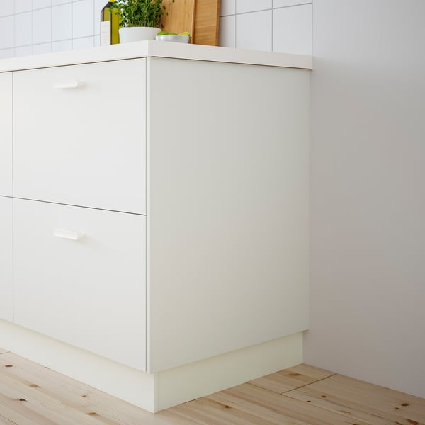 White VALLSTENA kitchen cabinet, modern design, clean surface, small plants on top.