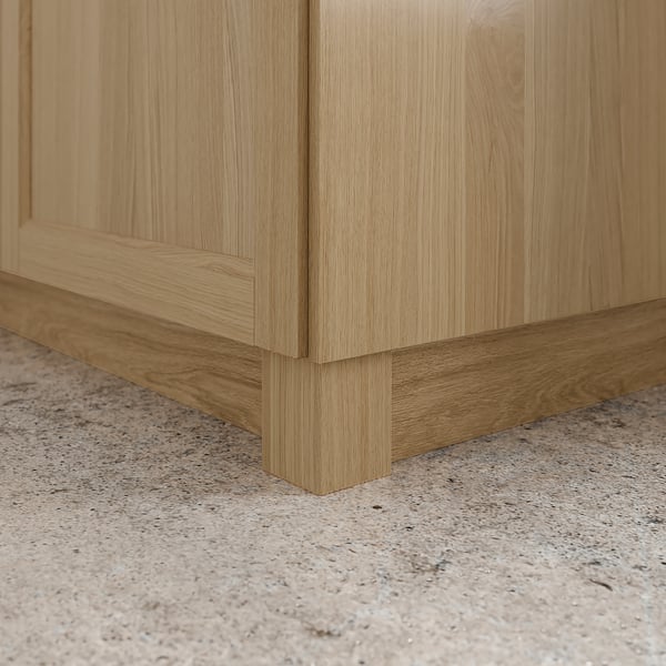 Wooden kitchen cabinet plinth, connecting base of cabinet to floor for uniform, polished look.