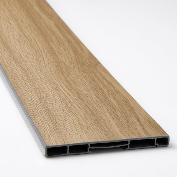 Close-up of VEDHAMN oak flooring plinth, showcasing its smooth, natural wood texture and sturdy design.