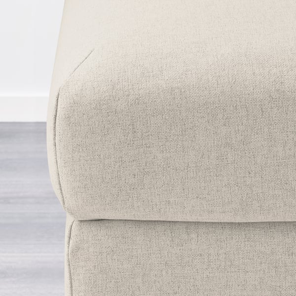 Beige upholstered furniture corner; plush, clean, quality fabric.