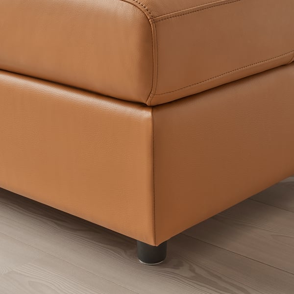 Close-up of VIMLE sofa, well-crafted with smooth, grain leather, sleek seams, black legs.