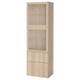 An IKEA BESTÅ storage unit in light oak. It glass doors for display and solid doors below for hidden storage, with a sleek, tall, rectangular design.