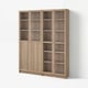 A BILLY bookcase, light brown, with wooden construction and multiple glass doors.