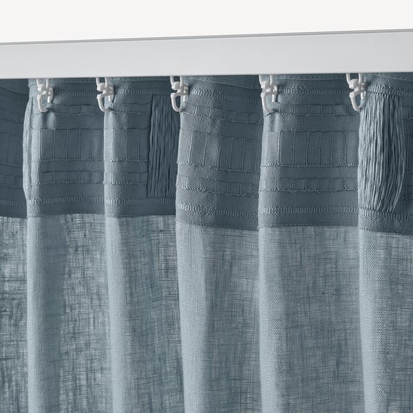 Gray-blue curtains with tasselled pulls