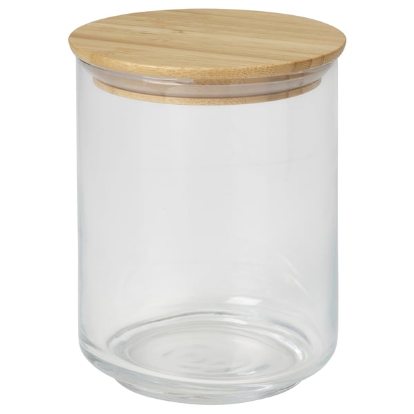 Clear glass jar with bamboo lid for storing dry food.