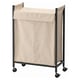 ENHET laundry hamper, beige, fabric on wheels, rectangular, convenient and movable design.