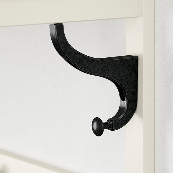 Black metal coat hook, securely attached to a white wall, protruding slightly for easy access.
