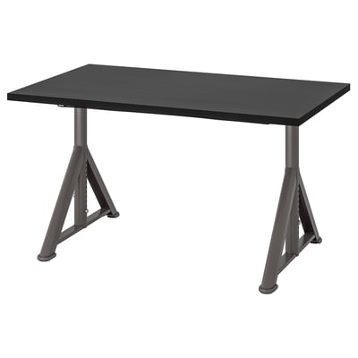 An IDÅSEN black desk with a rectangular top and metal legs in a trestle design, suitable for various uses.