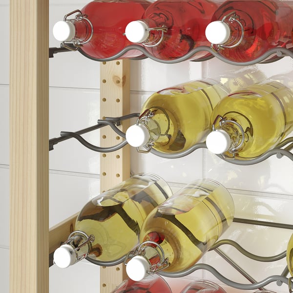 Six wine bottles, red and white, stored on metal racks attached to a wooden wall panel. Shelf spacing is adjustable.
