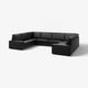 Large black leather sectional sofa with deep seating and low armrests, ideal for relaxation.