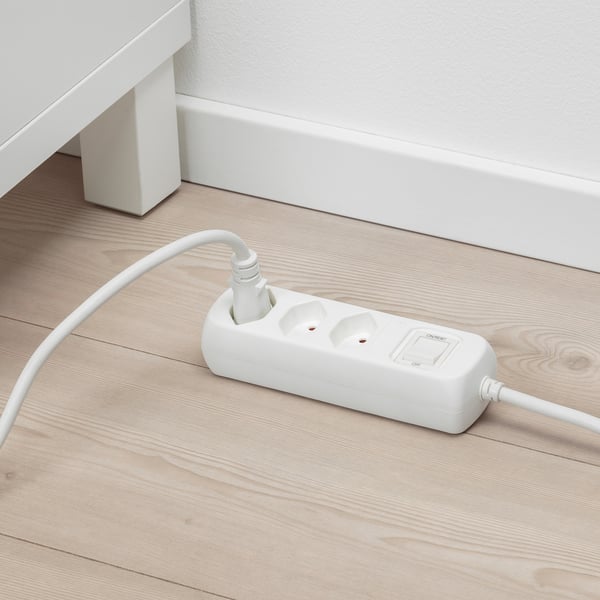 White surge protector with 3 grounded sockets and safety shutters.