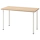 An IKEA LAGKAPTEN desk with light wood top and white metal legs. Its rectangular, modern, and minimalist, ready for easy assembly.