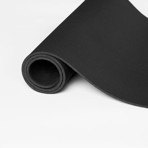 Black rolled-up gaming mouse pad with smooth surface for quick mouse movements.
