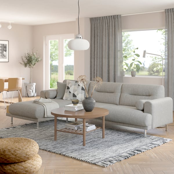 Modern living room with LÅNGARYD sofa, coffee table, and large windows.
