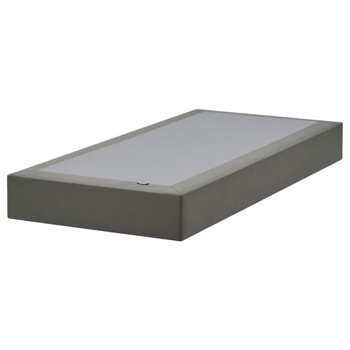 A flat-pack LYNGÖR bed base in grey, made of solid pine and recycled polyester, featuring removable covers.