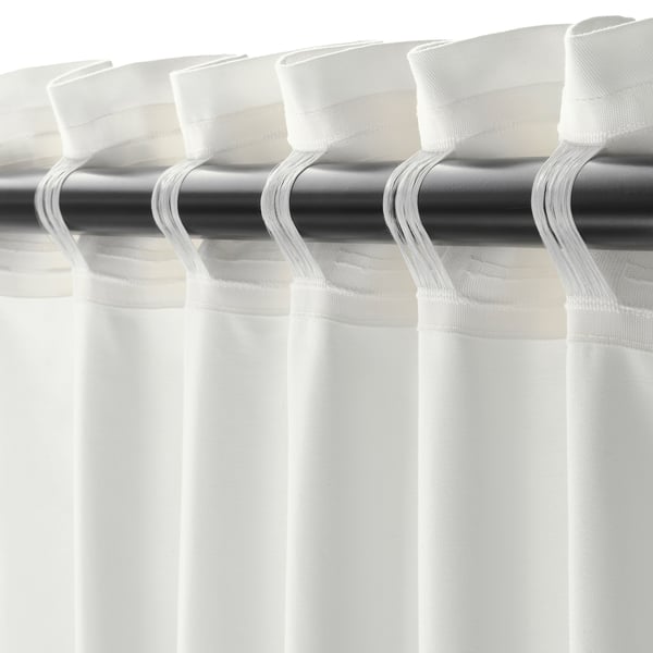Darkening curtains with hooks, block light.