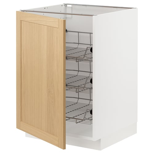 A white kitchen cabinet with wooden door open, revealing wire shelves inside.