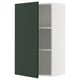 A METOD kitchen cabinet with a deep green havstorp door, featuring a white frame and adjustable shelves.