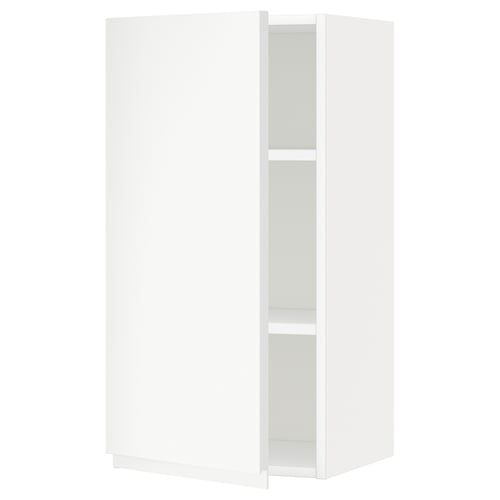 A white METOD kitchen cabinet with a simple, modern design and adjustable shelves. It a door with integrated handles and a sturdy frame.