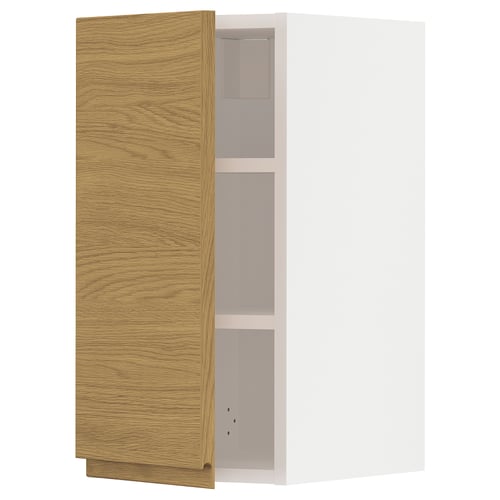 A wooden cabinet with a light oak finish and minimal design. It has three empty compartments and is part of the METOD kitchen system.