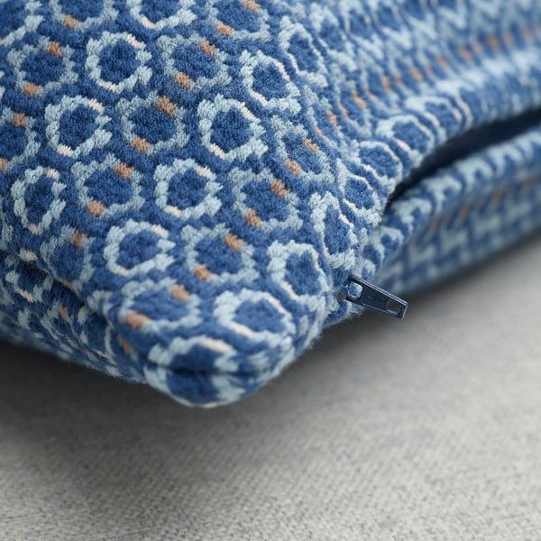 Decorative cushion cover with intricate blue patterns, high-quality texture, and prominent zip.