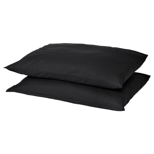 Two black square pillows stacked, smooth dark fabric, simple design.