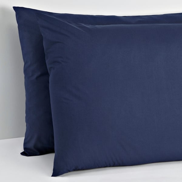 Two dark blue pillows stacked neatly, ideal for bedding.