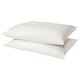 Two white, rectangular pillows with smooth, cotton covers stacked neatly.