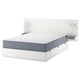 Minimalist white bed with grey mattress, integrated storage, modern design.