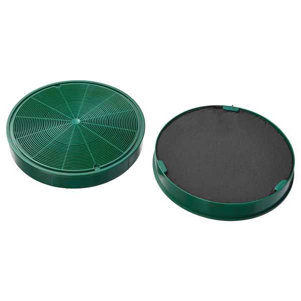 Two green round charcoal philtres. One is open with structures, the other covered in mesh.
