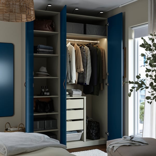 Blueprint wardrobe interior with shelves, drawers, and clothes hangers, integrated lighting.