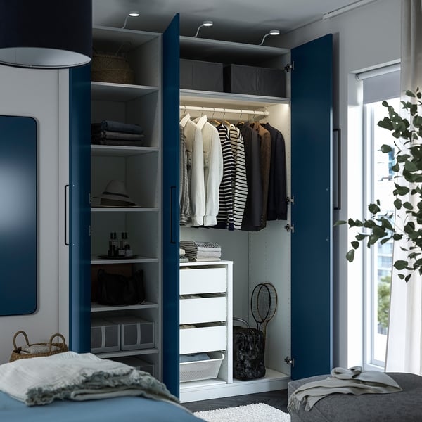 Blue wardrobe with open doors revealing organised clothes, hangers, and storage compartments.