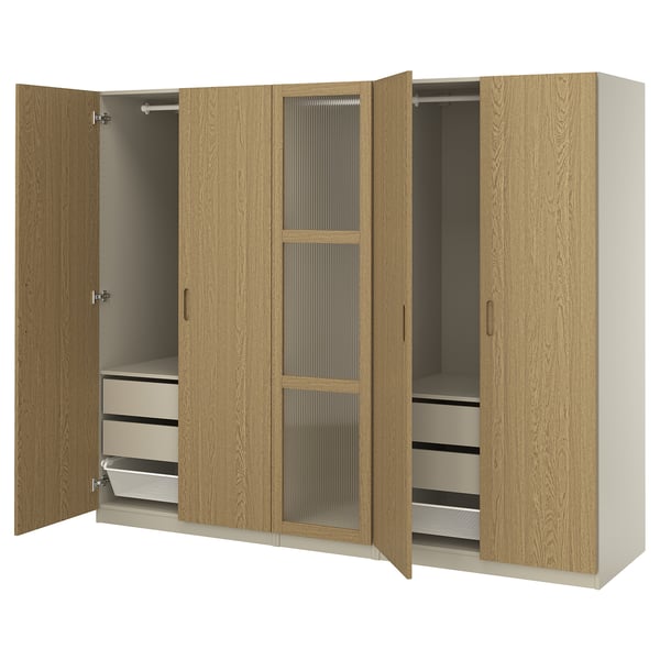 Wooden wardrobe PAX in oak colour with metal handles, featuring two open sections.