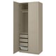 A beige PAX wardrobe with open doors, featuring drawers and a hanging rail inside.