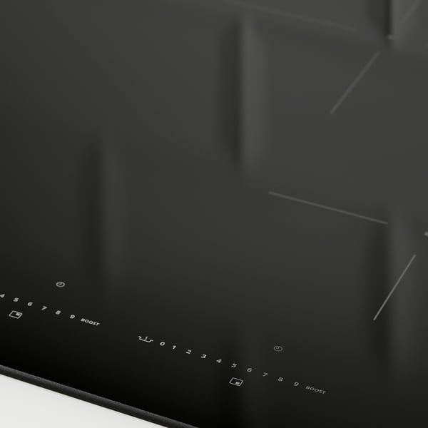 Modern, sleek black induction cooktop with touch controls, featuring multiple cooking zones and power boost options.