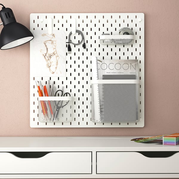 SKÅDIS pegboard with office supplies and lamp.