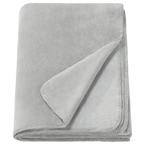 A folded light grey SLÅNGRÅMAL throw blanket made from soft, recycled polyester. It has a smooth, uniform design with stitched edges.