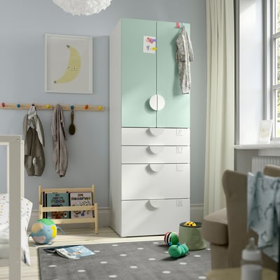 Childrens room with light blue SMÅSTAD wardrobe, toys nearby.